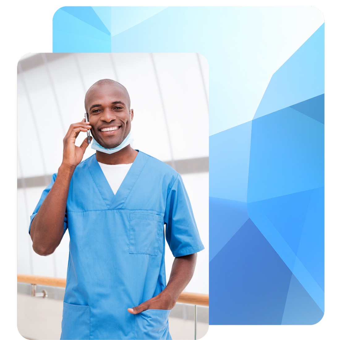 A clinician in scrubs speaking with a colleague by phone